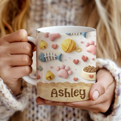 Personalized Cute Cat Mug - Pet Lover Gift with name, pastel 3D style design featuring paw prints, yarn balls, fish bones, cat food bowl and heart icons, custom cat lover gift for pet mom